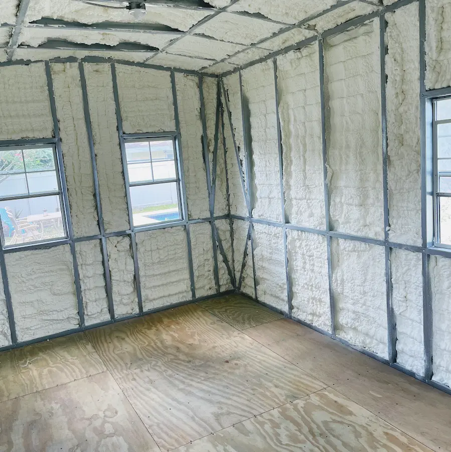 Closed-cell spray foam insulation applied to wall cavities in a residential project in Belleville