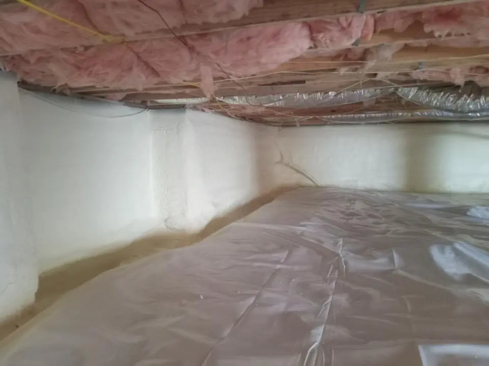 Crawl space encapsulation with closed-cell spray foam for Storm Damage Roof Repair in Belleville